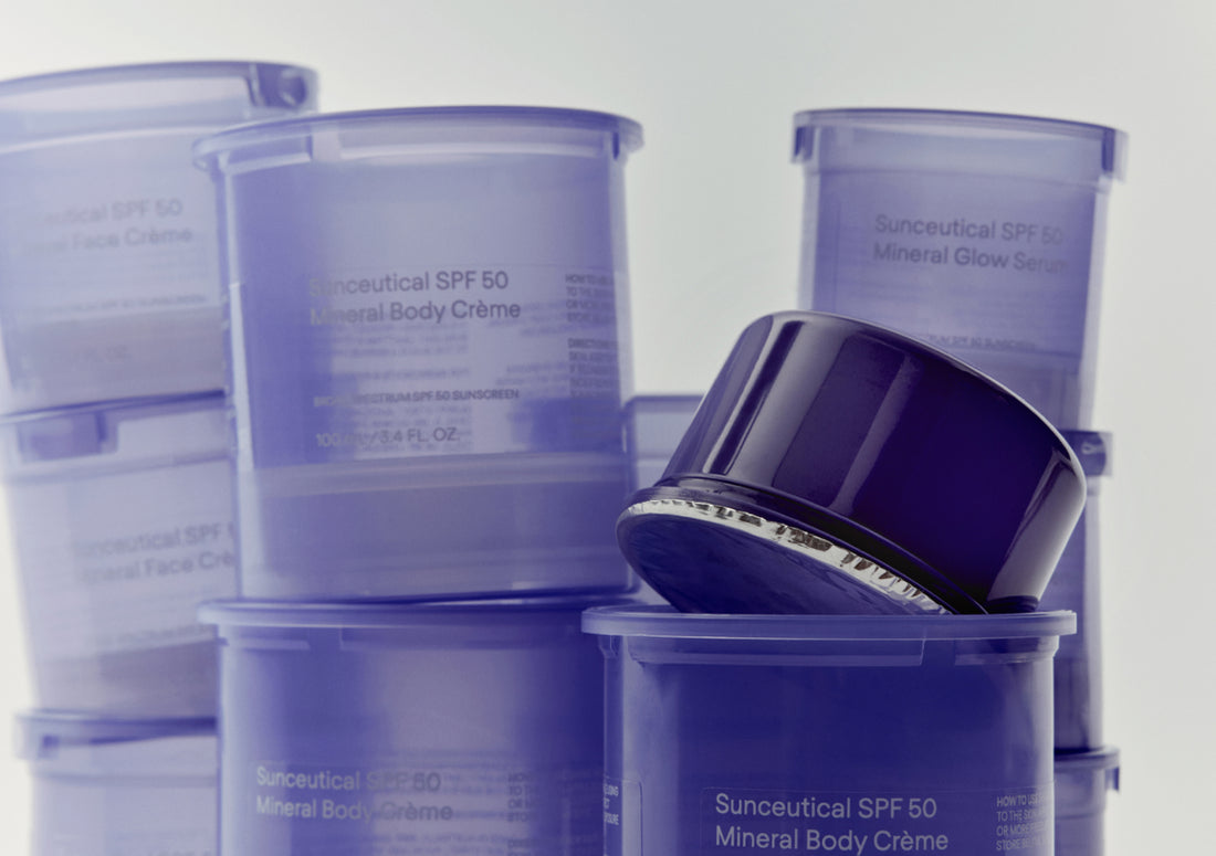 Cosmetic containers with labels on a light gray background